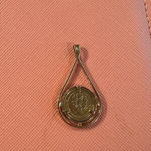 14 carat real gold, a pendant in the shape of a drop with a coin inside, 2.5 g